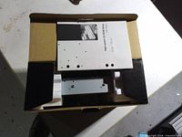 Open box showing drive, foam inserts and manual