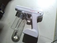 Right side view of white nano atomizer with bottle attached