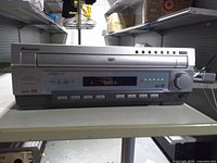 Front view showing brand, tray, display and controls