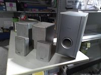 Full set showing subwoofer and four satellites