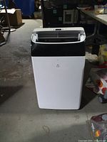 Front view of portable AC showing vent and logo