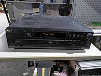 Front view showing RCA logo, controls, display lit