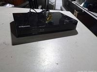 Front and top view of Samsung Blu-ray player