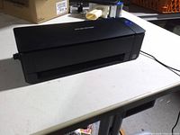 Top view of Fujitsu ScanSnap iX1300 scanner, closed lid, visible power cable