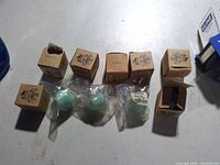 Six original boxes and four bagged jadeite knobs visible