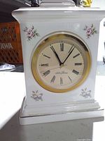 Front view showing dial, floral decals, bezel wear