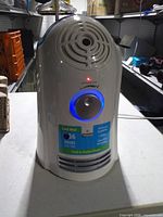 Front view of humidifier showing controls, indicator light and product label