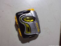 Front view showing Sony branding, clear cassette window, Sports logo