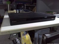 Front angled view of Sony Blu-ray player on table