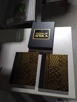 Slipcase with gold title, two matching hardcover books