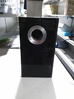 Front view showing gloss finish and silver port ring