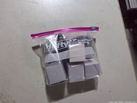 Bag showing four white boxes labelled chargers