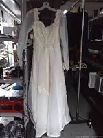 Full view of gown hanging on rack