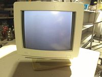 Front view of Dell CRT monitor powered on