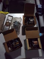 Four boxed reels, Niagara hook holder, bag of small tackle