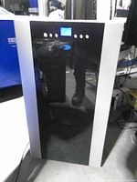 Front view showing black panel and silver sides of the portable AC unit