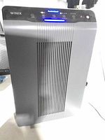 Front view of Winix 5300-2 air purifier showing control panel and grille