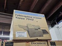Sealed Xerox 7042 laser printer retail carton on shelf