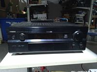 Front view of Yamaha receiver showing display, controls and Yamaha branding