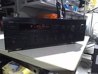 Front of Yamaha receiver showing display and controls