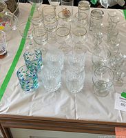 Overview of entire 32-piece glass set on table