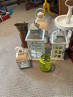 Group shot of assorted lanterns, lime green lantern, copper vase