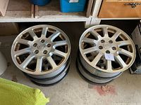 Two stacks of two alloy wheels each