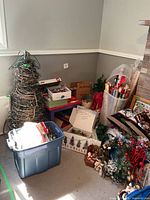 Full lot showing grapevine tree form, tote, boxes, wreath and decorations