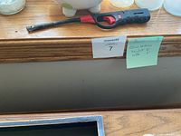 overall view showing piggy bank, lighter, glass jars