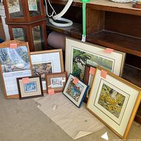 Group shot showing all framed prints leaning against cabinet