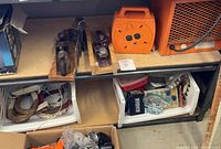 overview showing three wooden planes, cord reel, heater grille