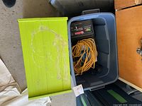 Open tote showing charger and extension cord