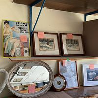 Overall view showing Colgate sign, two framed prints, oval mirror, clock/barometer, photographic print