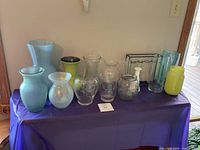 Full lineup of assorted vases on table