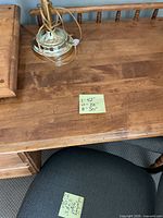 Desk top with brass lamp, measurement note visible