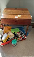 Front view of wood desk with supply box underneath