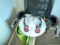 Spirit recumbent bike seat with DR-HO'S foot massager and yoga mat visible