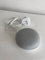 Google Home Mini top view with power adapter