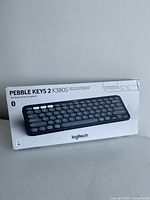 Front of sealed Logitech Pebble Keys 2 K380S keyboard retail box