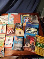 Group shot of all books and playing cards