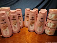 Group of Dove x Crumbl body washes and scrubs on table