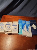 Group shot of all eight boxed refrigerator filters on table