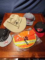 All five headwear items displayed on table