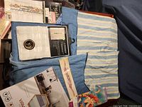 Group shot of all items including curtain panels, tile boxes, stencil packet and Disney border