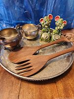 Group shot showing platter, mouse shakers, wood servers, and silver cups