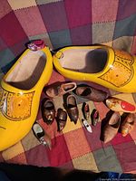 Group shot with full-size yellow clogs and surrounding miniatures