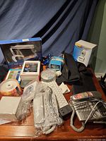 Group shot of all assorted office and electronic items on table