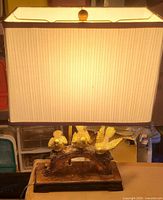 Lamp lit showing full view with shade and base