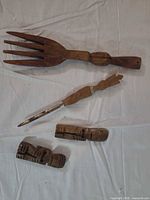 Group shot showing fork, letter opener, two figures