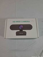 Front of original box showing webcam image and HD WEB CAMERA text
